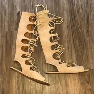 Chloe tall gladiator sandals.